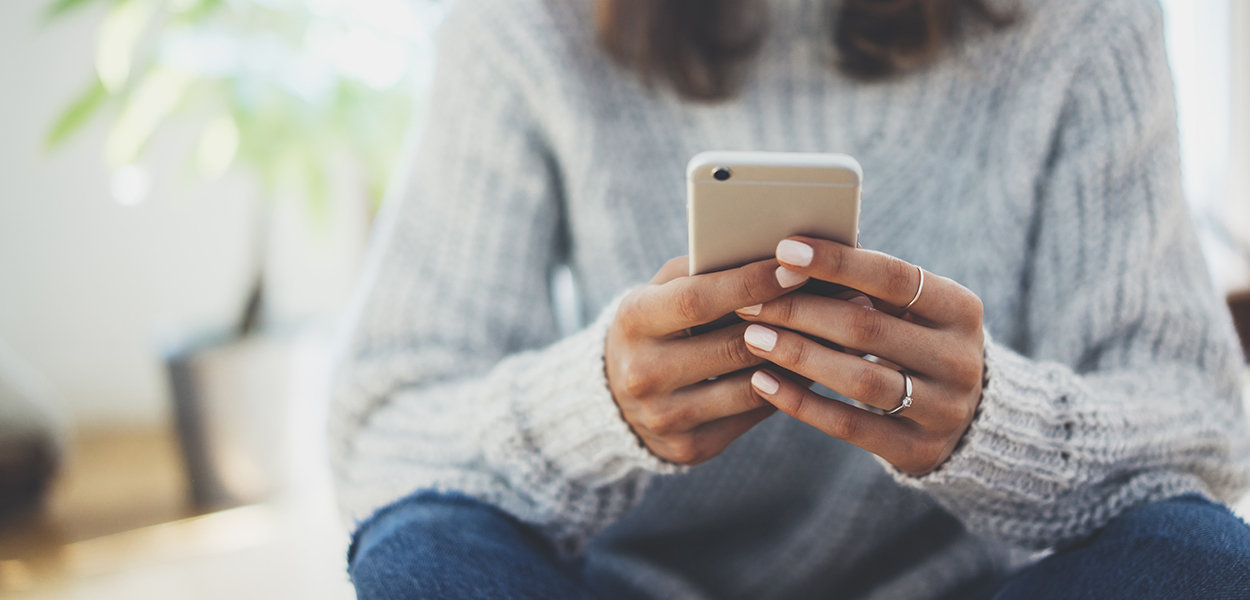 Image of person holding a cell phone